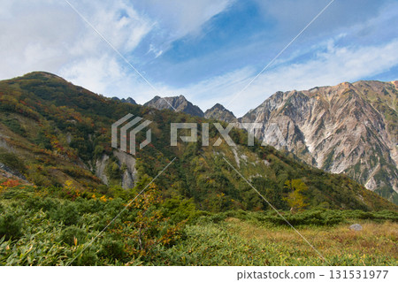 The Sword of Fukiya seen from the Happo-one Nature Study Trail in autumn leaves, Hakuba Village, Nagano Prefecture 131531977