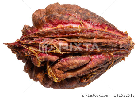 Peach or apricot pit with a rough texture on an isolated background Peach or apricot pit with a rough texture on an isolated background 131532513