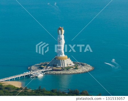Guanyin statue at seaside in nanshan temple, hainan island , China. Words mean mercy and blessing. 131533057