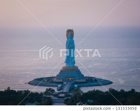 Guanyin statue at seaside in nanshan temple, hainan island , China. Words mean mercy and blessing. 131533058