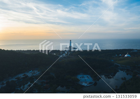 Guanyin statue at seaside in nanshan temple, hainan island , China. Words mean mercy and blessing. 131533059