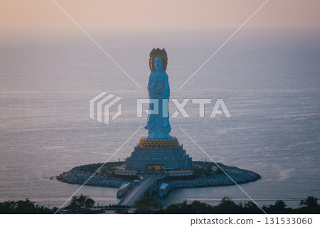 Guanyin statue at seaside in nanshan temple, hainan island , China. Words mean mercy and blessing. Guanyin statue at seaside in nanshan temple, hainan island , China. Words mean mercy and blessing. 131533060
