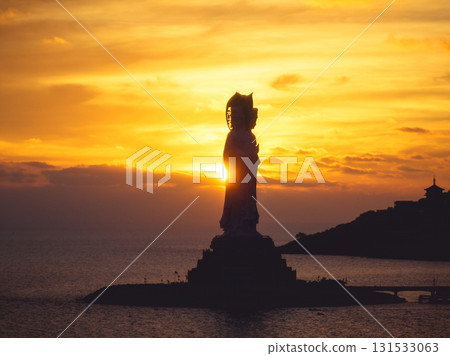 Guanyin statue at seaside in nanshan temple, hainan island , China. Words mean mercy and blessing. 131533063