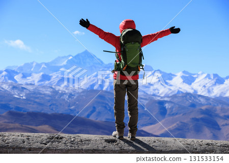 Successful woman hiker open arms to Mount Everest in Tibet, China 131533154