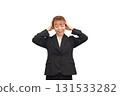 A worried woman in a business suit 131533282