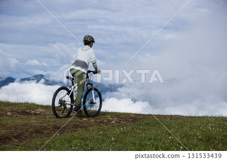 Riding mountain bike on beautiful mountain top 131533439
