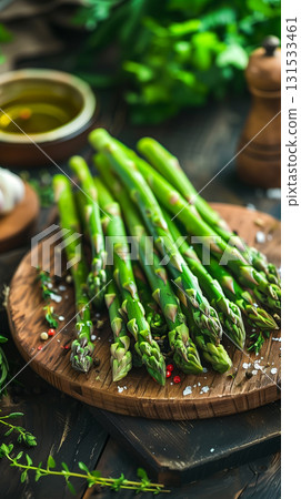 Fresh asparagus spears arranged on a dark surface ready for cooking or eating 131533461