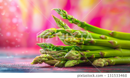 Fresh asparagus spears arranged on a color surface ready for cooking or eating 131533468