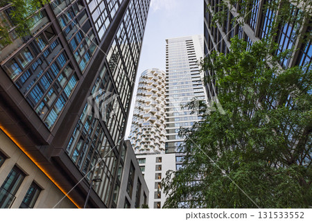 Low Angle View of Modern Skyscrapers and Glass Facades Framing an Urban Skyline Low Angle View of Modern Skyscrapers and Glass Facades Framing an Urban Skyline 131533552