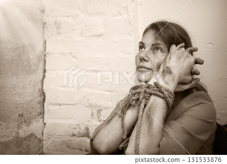 Young pretty sad bounded girl 131533876