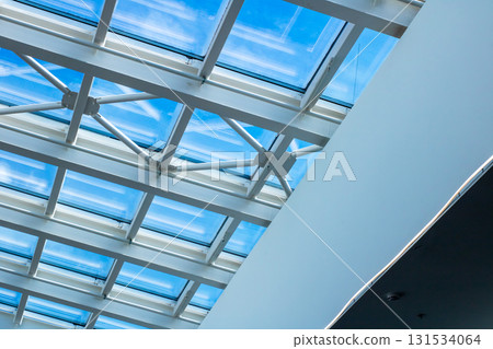 I see a clear blue sky through a beautiful skylight I see a clear blue sky through a beautiful skylight 131534064