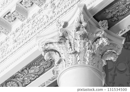 Intricate Corinthian capital featuring acanthus leaves and scrollwork 131534500