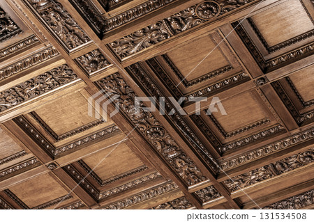 Elegant close-up of a historical wooden ceiling with square coffers 131534508