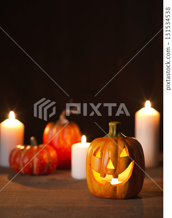Halloween image: ghost pumpkin and candles 131534538