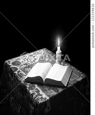 Big old bible and candle 131534616