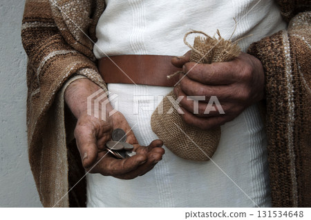 Ancient man with silver coins 131534648