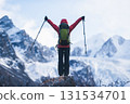 Backpacking woman hiking around the large hanging glacier on high altitude mountain top 131534701