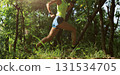 Woman trail runner running at tropical forest mountain peak 131534705