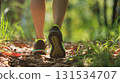 Woman runner running on forest trail 131534707