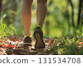 Woman runner running on forest trail 131534708