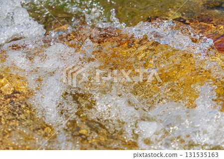 Early summer waterside: Close-up of the clear stream's water surface 235 131535163
