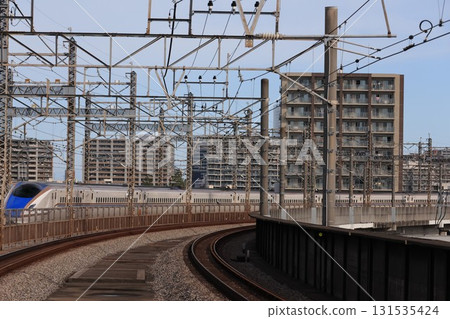 A Hokuriku Shinkansen train heading towards Omiya Station A Hokuriku Shinkansen train heading towards Omiya Station 131535424