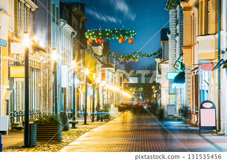 Parnu, Estonia. Night View Of Famous Ruutli Street With Old Buildings, Restaurants, Cafe, Hotels And Shops In Festive Evening Night Christmas Xmas New Year Illuminations . Night starry stars sky. 131535456