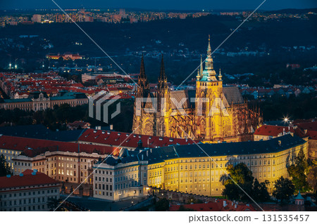 Prague, Czech Republic. Night View Of Prague Castle, St. Vitus Cathedral. Lesser Town, Prague Castle In Night Lighting Illumination. Famous Landmark, UNESCO World Heritage Prague, Czech Republic. Night View Of Prague Castle, St. Vitus Cathedral. Lesser Town, Prague Castle In Night Lighting Illumination. Famous Landmark, UNESCO World Heritage 131535457