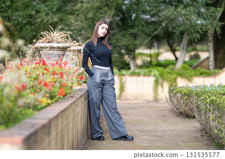 Young woman posing in a park and garden 131535577