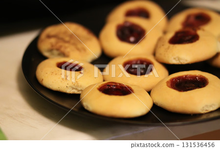 Homemade round cookies filled with strawberry jam. 131536456