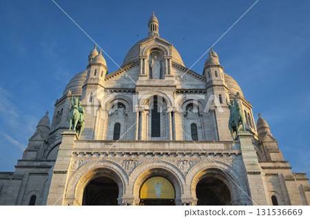 Montmartre sunset view of Sacre Coeur Basilica in Paris with vibrant skies 131536669