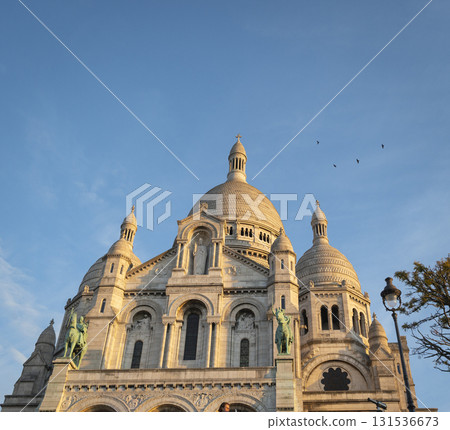 Montmartre sunset view of Sacre Coeur Basilica in Paris with vibrant skies Montmartre sunset view of Sacre Coeur Basilica in Paris with vibrant skies 131536673