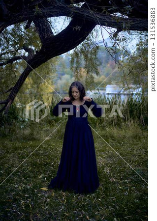 a woman in a black long dress for Halloween, Dracula's bride, vampires, modern witch a woman in a black long dress for Halloween, Dracula's bride, vampires, modern witch 131536883