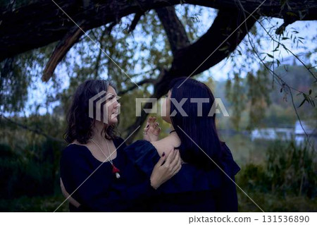 two women in the black long dresses on Halloween, brides of Dracula, vampires, bite, kiss, two women in the black long dresses on Halloween, brides of Dracula, vampires, bite, kiss, 131536890