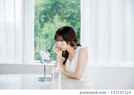 A young woman suffering from skin problems A young woman suffering from skin problems 131537124