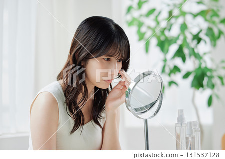 A young woman suffering from skin problems A young woman suffering from skin problems 131537128