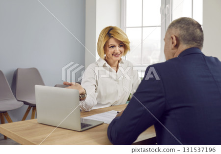 Woman having consultation with lawyer, real estate or insurance agent Woman having consultation with lawyer, real estate or insurance agent 131537196