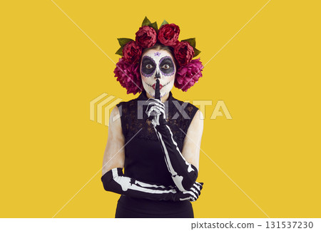 Woman in spooky costume asking you to keep her secret on Day of the Dead or Halloween Woman in spooky costume asking you to keep her secret on Day of the Dead or Halloween 131537230