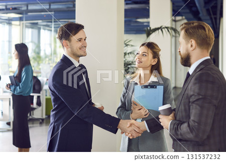 Professional Business People Shaking Hands During Office Meeting 131537232