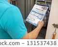 A man looking at an envelope requesting a national tax investigation 131537438