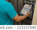 A man looking at an envelope requesting a national tax investigation 131537440
