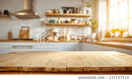 Wooden table in focus, with bright kitchen and warm golden sunlight bokeh backdrop. Wooden table in focus, with bright kitchen and warm golden sunlight bokeh backdrop. 131537518