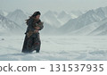 Asian woman walks through snowy mountains holding baby. 131537935