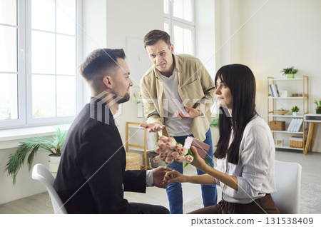 Love triangle drama with emotional reactions and jealous tension indoors Love triangle drama with emotional reactions and jealous tension indoors 131538409