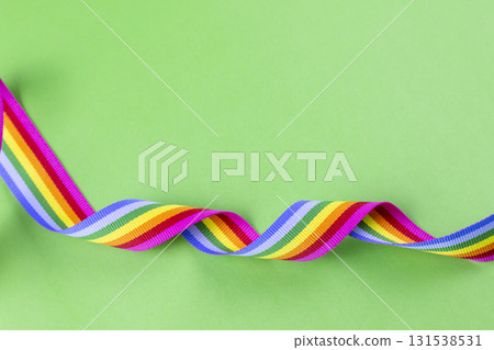 Rainbow ribbon on green background representing LGBT pride 131538531