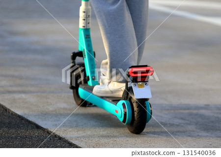 Image of an electric kickboard running on the road 131540036