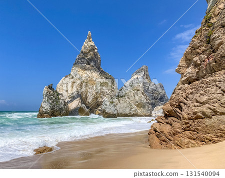 Ursa beach features dramatic rock formations and golden sand. Ursa beach features dramatic rock formations and golden sand. 131540094