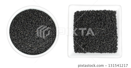 Nigella sativa or Black cumin in ceramic bowl isolated on white background. Top view. Flat lay. Nigella sativa or Black cumin in ceramic bowl isolated on white background. Top view. Flat lay. 131541217