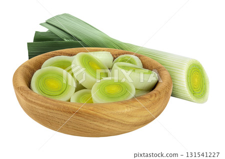 sliced Leek vegetable in wooden bowl isolated on white background with full depth of field 131541227