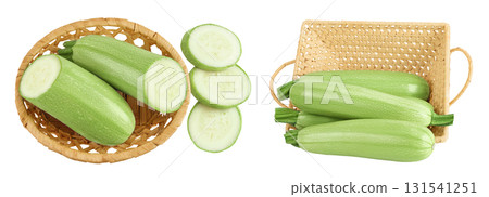 zucchini or marrow in a wicker basket isolated on white background with full depth of field. Top view. Flat lay zucchini or marrow in a wicker basket isolated on white background with full depth of field. Top view. Flat lay 131541251